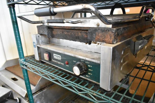 Waring WFG257 stainless steel commercial Panini press, 120 volts, 1 phase, with temperature dial and Tostato Supremo branding.