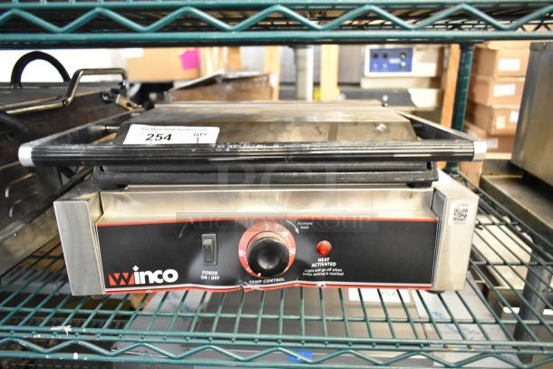 Winco ESG-1 stainless steel commercial countertop panini press, 120 volts, label "254" on top, intact condition.