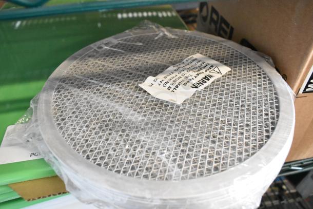 10 brand new items including American Metalcraft 18710 10" pizza screens and San Jamar green cutting boards, sealed in packaging.