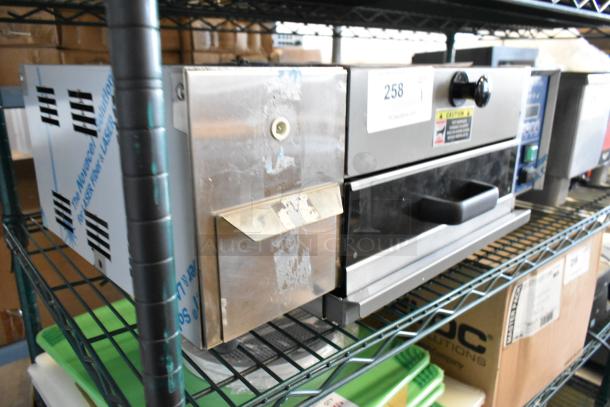 Antunes Stainless Steel Commercial Countertop Steamer, used condition, with visible label indicating model and caution instructions.