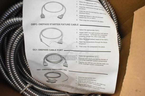 Brand new Reloc cable in box with detailed instructions for OSFC, OC1, and OST connections. Coiled metal sheathing visible.
