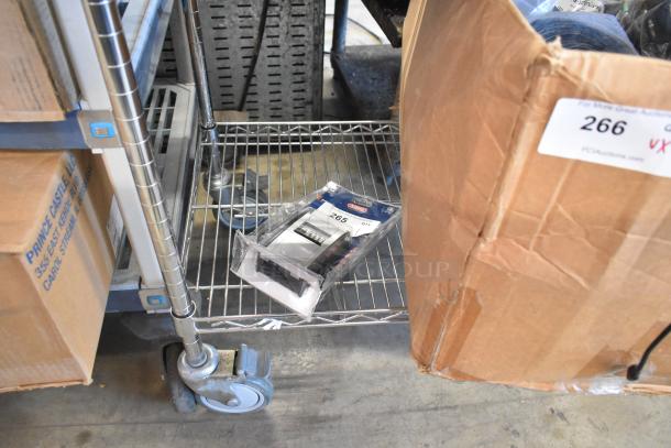 Brand new Abus KeyGarage in original packaging, visible on a metal shelf. Model number and packaging intact.