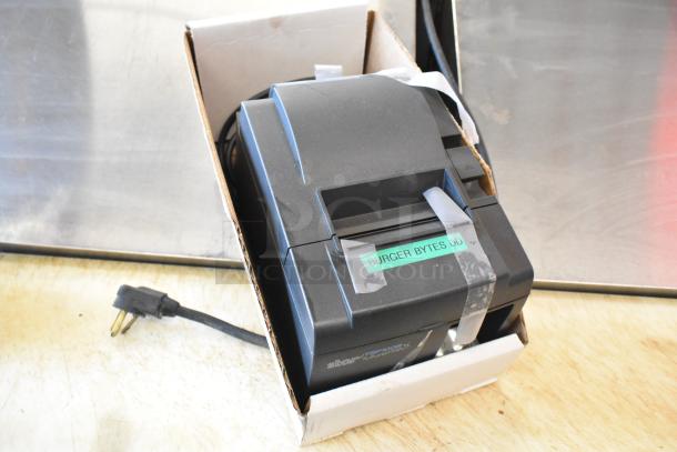 Brand new Star TSP100III receipt printer in box with power cord; sticker reads "Burger Bytes DD."