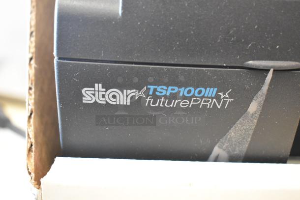 Brand new Star TSP100III receipt printer in box, showing model name on device.