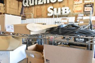 Lot of various wires on metal shelf, mixed condition. Includes power cords. Auction label: "PCAuctions.com 277 QTY VY2."