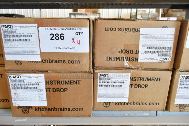Brand new Fast Z040120HFC timers in original boxes. Visible labels detail model, serial numbers, and auction information.