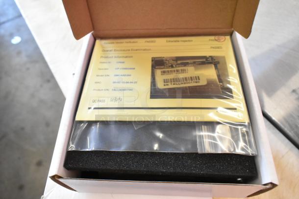 Brand new CyberPower Remote Management Card in box, Model RMCARD205, with quality control label and inspection details visible.