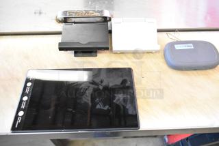 ALL ONE MONEY! lot with tablet and MiFi device. Includes tablet stand and two chargers. MiFi label reads "2144330842."