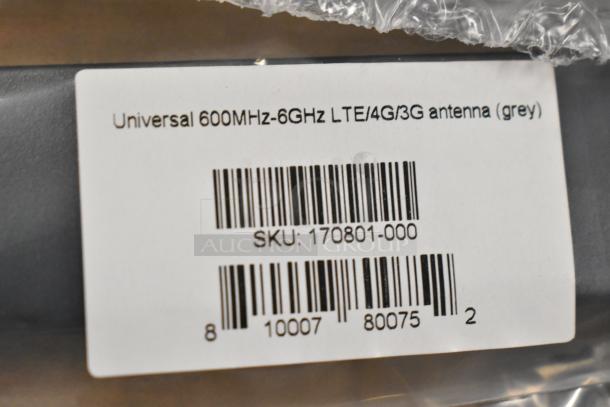 Universal 600MHz-6GHz LTE/4G/3G antenna in grey, new in box. SKU: 170801-000. Includes barcode.