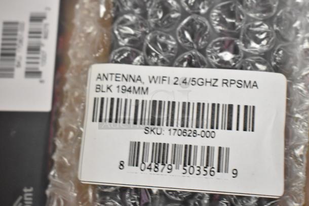 Brand new 2.4/5GHz WiFi antenna in box, RP-SMA connector, 194mm length, SKU: 170628-000, barcode visible.