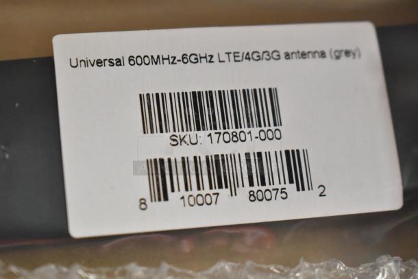 Universal 600MHz-6GHz LTE/4G/3G antenna in grey, new in box. Label shows SKU: 170801-000. Includes antenna details.