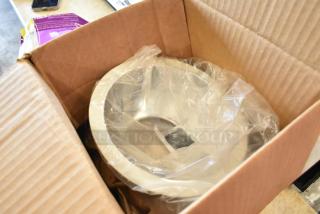 Brand new light frame in original box, wrapped in plastic, silver finish, unassembled, and pristine condition.