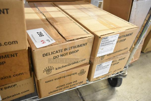 Four boxes of Fast Z040120HFC Timers, new in box, labeled as delicate instruments from Kitchen Brains.