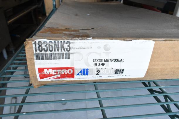 Brand new box of 2 Metro 1836NK3 wire shelves, labeled 18x36 Metroseal III SHF, made in USA.