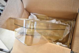 Box of 6 Carlisle 3086113 amber 1/3 size drop-in bins, brand new in open cardboard box, showcasing transparent design.
