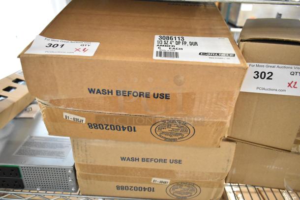 Box of 6 new Carlisle 3086113 amber 1/3 size drop-in bins. Labeled "Wash Before Use" and "Made in USA."