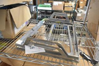 Brand new metal tray frame, two pieces, in original packaging. Includes auction tag "307 x2."