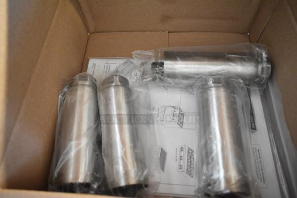 New set of 4 metal legs, silver, wrapped in plastic in a box, includes assembly instructions.