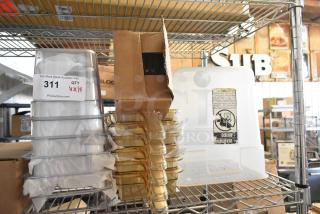 Brand new poly items, including drop-in bins, on a metal rack. Item tag shows "311, QTY 14" from PCIAuctions.com.