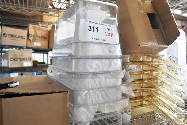 Brand new poly drop-in bins, 14 units, clear with labeling for auction. Boxes of similar items in background.