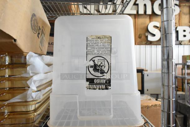 Brand new poly bin with warning label, stackable on metal shelf. Part of a lot of 14. Ideal for storage and organization.