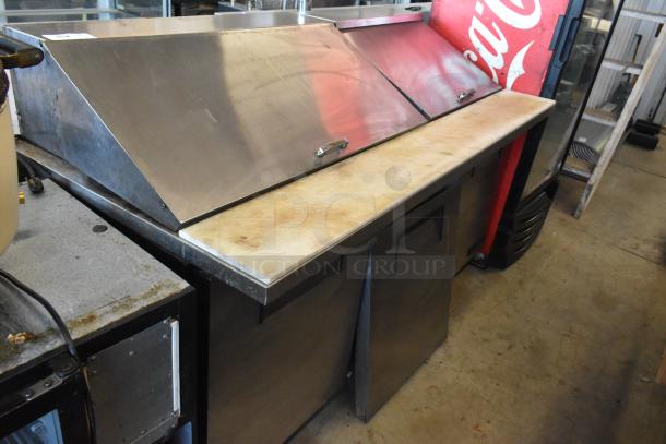 True TSSU-72-30M-S stainless steel commercial sandwich salad prep table with bain marie mega top, on casters; used condition.