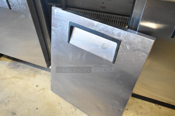 True TSSU-72-30M-S stainless steel sandwich prep table with visible wear, commercial casters, 115V, 1 Phase.