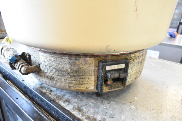 Rinnai RER-55AS-N rice cooker, natural gas powered, countertop model, visible wear, detailed instructions and controls shown.