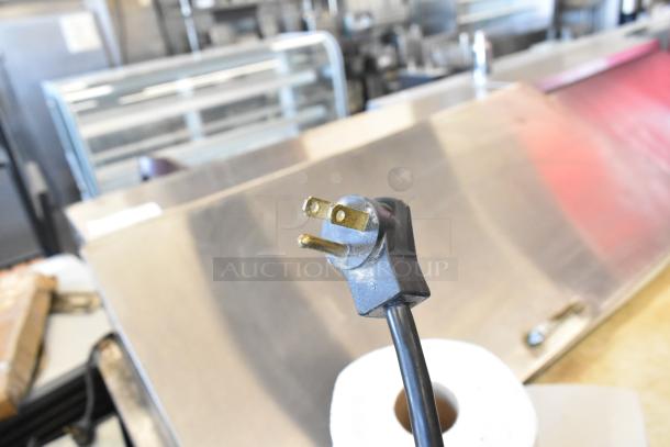 Beverage Air BB72G cooler cord plug, 115 volts, ideal for commercial use, shown against metal background.
