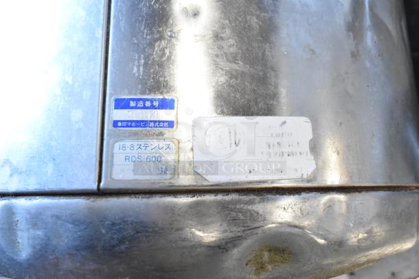 2 metal rice holders with visible wear, featuring engraved labels in Japanese, labeled as 18-8 stainless, model RDS-600.