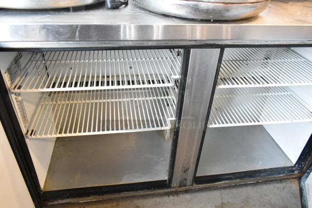 True TUC-48-LP stainless steel 2-door undercounter cooler. Features adjustable shelves, visible wear. 115 volts, 1 phase.
