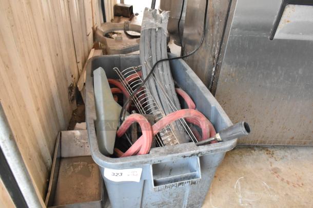 Lot of various items in a large blue poly bin, condition used. Includes hoses, metal racks, and miscellaneous tools.