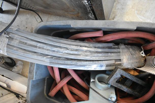 Lot of various industrial items in poly bin, including wrapped cables and hoses; suitable for miscellaneous use or parts.