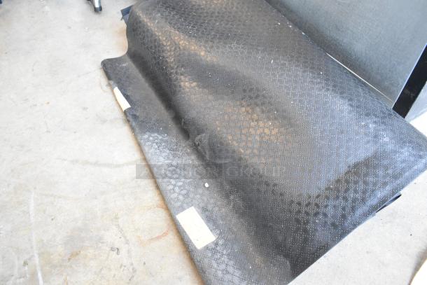 Two brown floor mats with textured pattern, in used condition. They show slight wear, suitable for interior use.