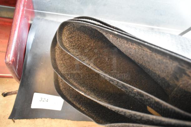 Two brown floor mats with textured surface, rolled and stacked. Includes label "324." Auction deal: double your bid offer.