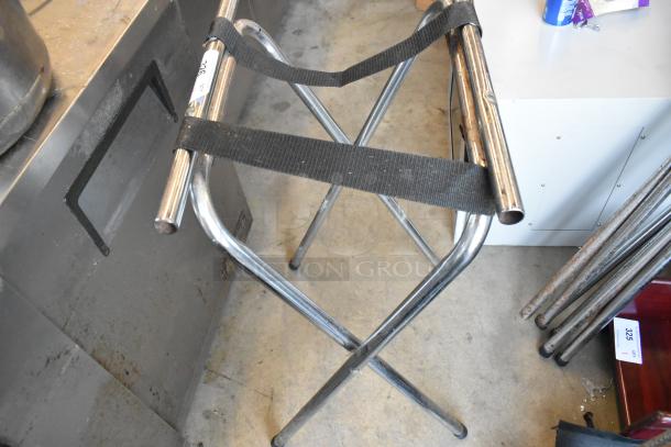 Four metal serving tray stands, foldable with black straps. Chrome finish, minimal signs of wear, labeled as lot 326.