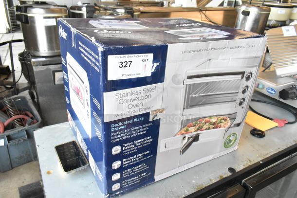 BRAND NEW Oster Stainless Steel Convection Oven in box. Features dedicated pizza drawer, turbo baking, large capacity.