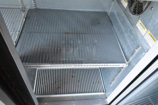 Beverage Air BB72G commercial back bar cooler interior, showing metal shelves and warning labels. 115 Volts, 1 Phase.