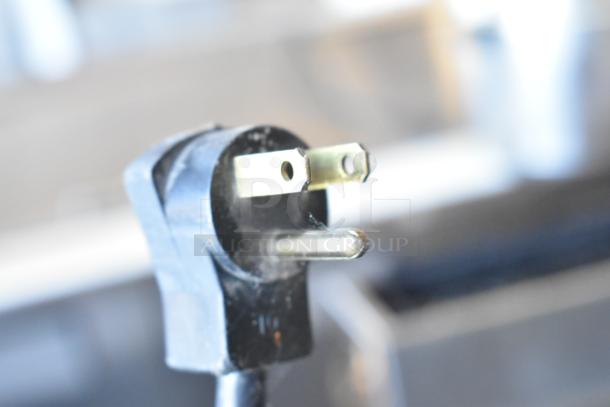 Close-up of a standard three-prong plug for the Beverage Air BB72G back bar cooler, 115 volts, 1 phase.