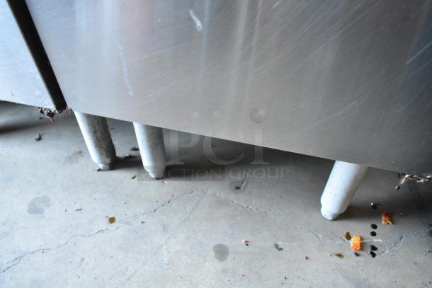 Pitco Frialator SG14 commercial stainless steel fryer with side splash guard. Floor style, natural gas, 110,000 BTU. Used condition.