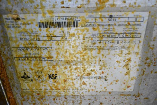 Pitco Frialator SG14 deep fat fryer label, showing model, 110,000 BTU, natural gas, and clearance specifications. Surface appears worn.