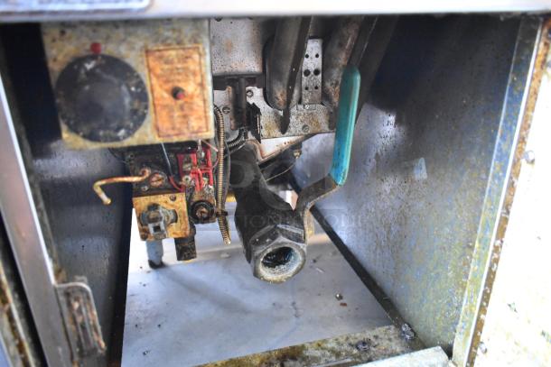 Pitco Frialator SG14 stainless steel commercial fryer, natural gas, 110,000 BTU, used condition, interior view.