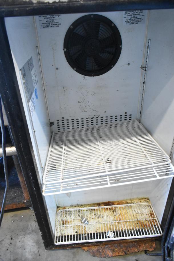 Imbera VR06 commercial mini cooler with single door; visible wear, rust, and grime internally; 115 volts, 1 phase.