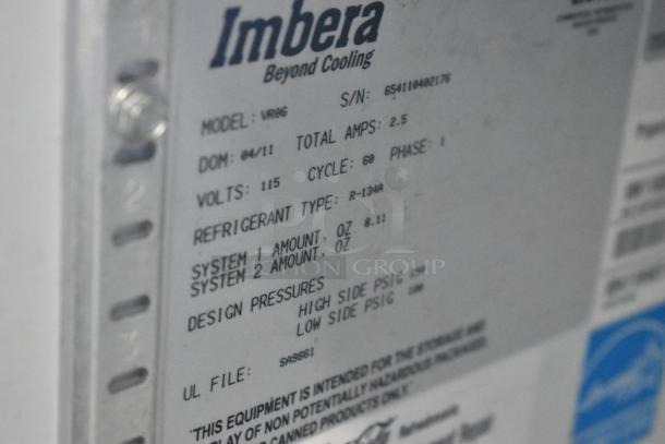 Imbera VR06 cooler label showing model, voltage 115, and refrigerant type R-134a. Serial number visible.