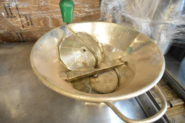 6 kitchen tools including a San Jamar ice bucket, ricer, mandolin slicer, and whipped cream dispensers; well-used condition.