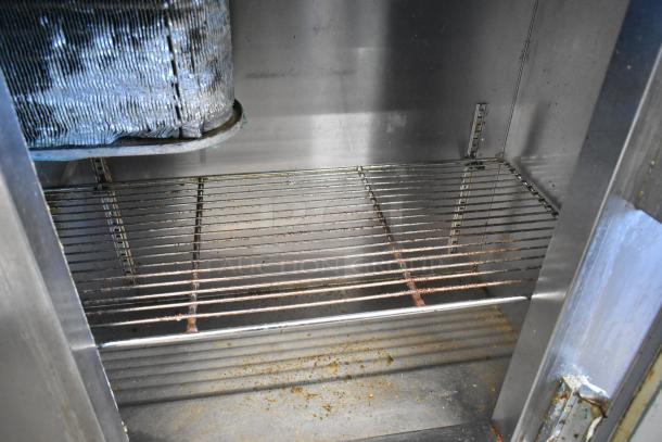 Leader LB60 S/C 2-door stainless steel cooler interior, showing wire shelving and internal structure. Visible wear and surface residue.
