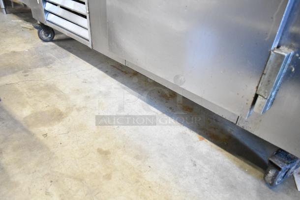 Leader LB60 S/C stainless steel commercial cooler, 2 doors, worktop, 2-tier shelf, 115V, 1 phase, on casters, used condition.
