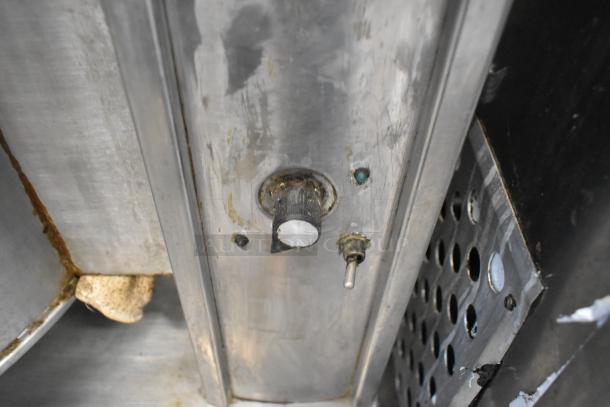 Cleveland KET-20T stainless steel 20-gallon tilting kettle, showing control knob and surface wear.