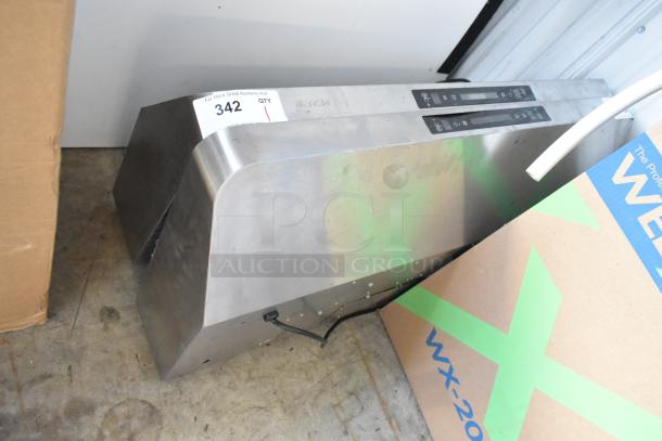 Stainless steel metal range hood with digital controls. Slight wear visible; auction tag 342 attached.