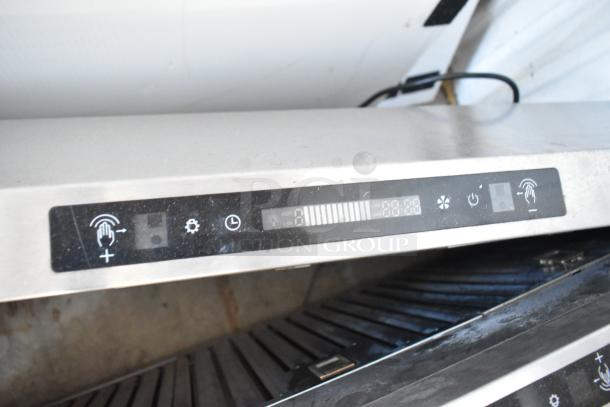 Stainless steel metal range hood with digital control panel, touch buttons, and sleek design. Excellent condition.